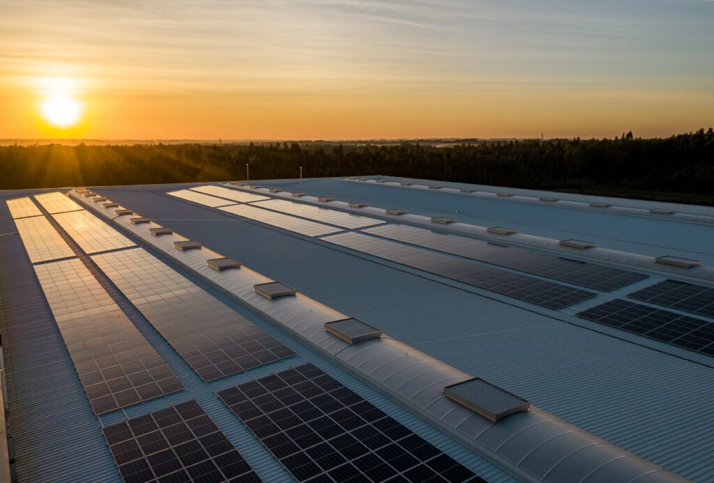 rooftop solar panels illuminated by the sun